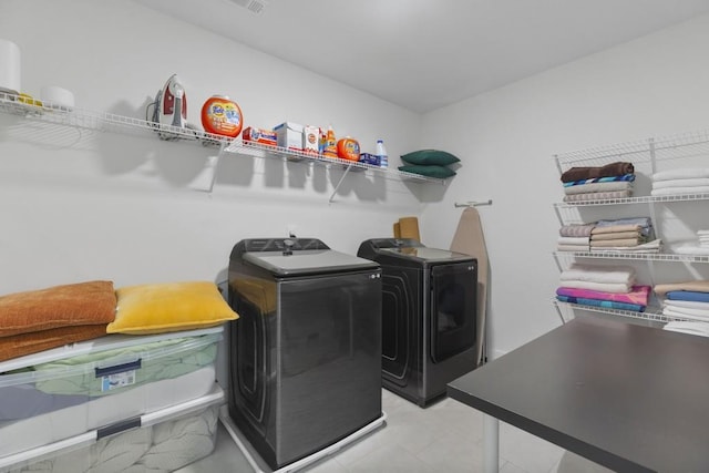 laundry area featuring laundry area and separate washer and dryer