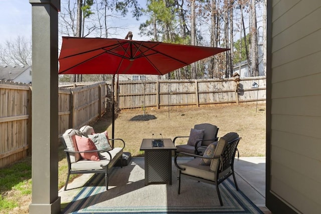 view of patio featuring an outdoor hangout area and a fenced backyard