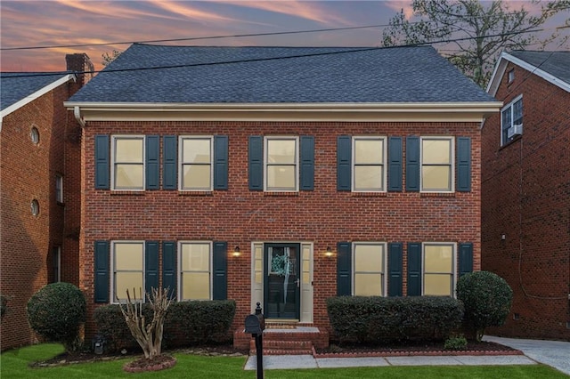 view of front of house with a yard