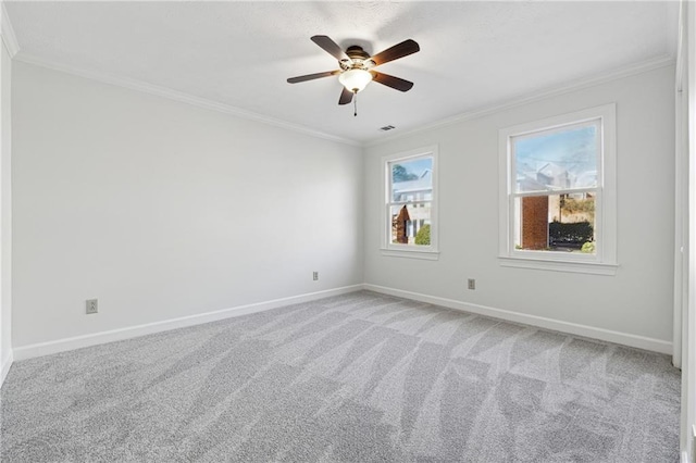 unfurnished bedroom with crown molding, ceiling fan, a closet, and carpet