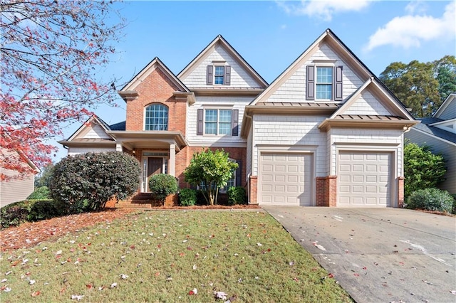 craftsman inspired home featuring a garage and a front lawn