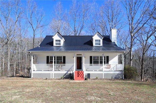 cape cod home with a porch and a front yard