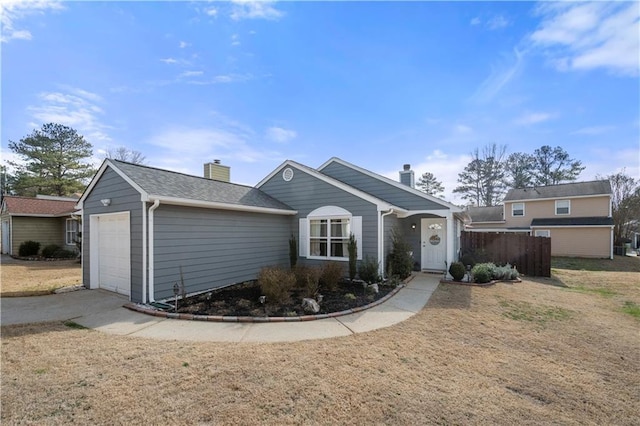 view of front of home featuring a garage and a front yard