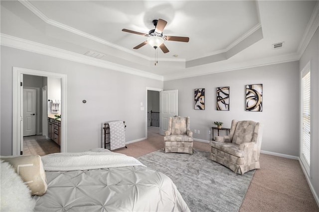 carpeted bedroom featuring a raised ceiling, visible vents, and baseboards