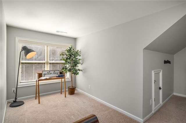 carpeted office with visible vents and baseboards