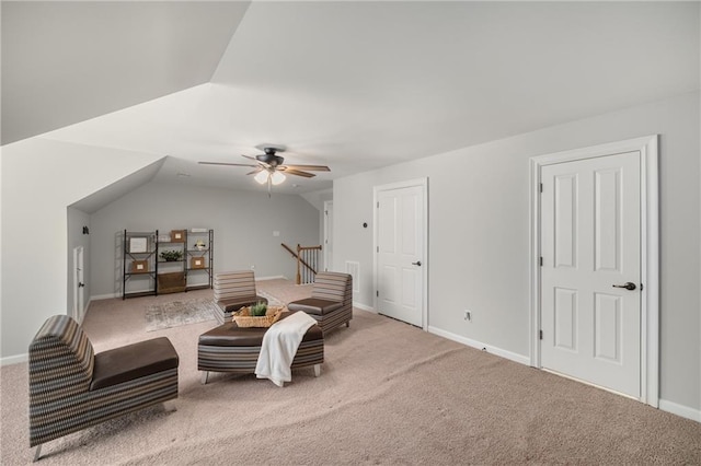 sitting room featuring vaulted ceiling, carpet floors, and baseboards