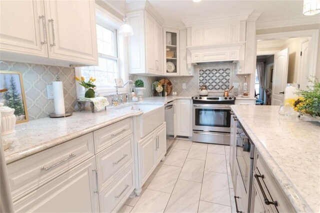 3 Westridge Pl, Rome, GA 30165 - kitchen with light stone countertops, appliances with stainless steel finishes, white cabinets, and decorative light fixtures