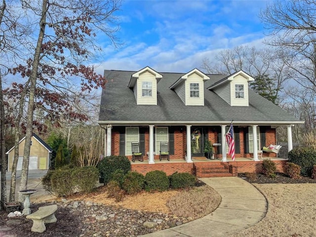 new england style home with covered porch