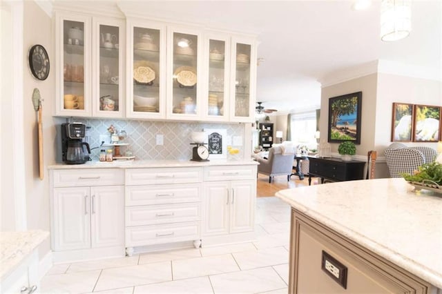 3 Westridge Pl, Rome, GA 30165 - kitchen featuring light stone counters, decorative backsplash, and white cabinets