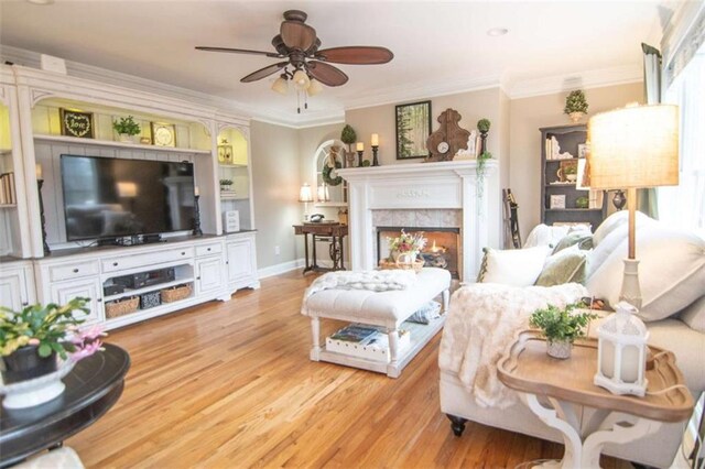 3 Westridge Pl, Rome, GA 30165 - living room featuring ornamental molding, a high end fireplace, ceiling fan, and light hardwood / wood-style floors