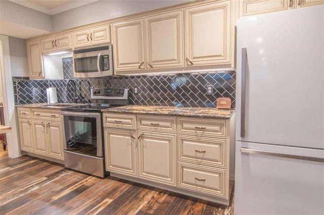 3 Westridge Pl, Rome, GA 30165 - kitchen with appliances with stainless steel finishes, dark hardwood / wood-style flooring, and cream cabinetry