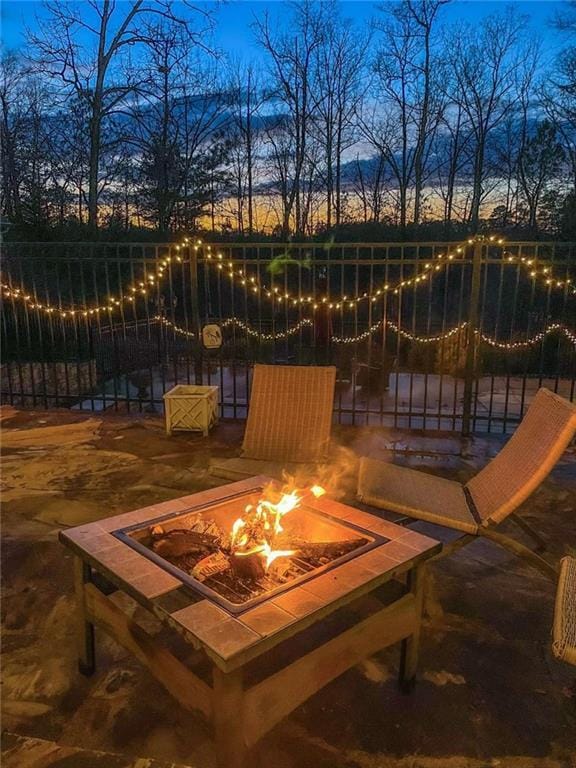 3 Westridge Pl, Rome, GA 30165 - patio terrace at dusk featuring an outdoor fire pit