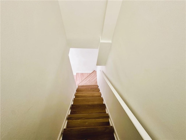 stairway with wood finished floors