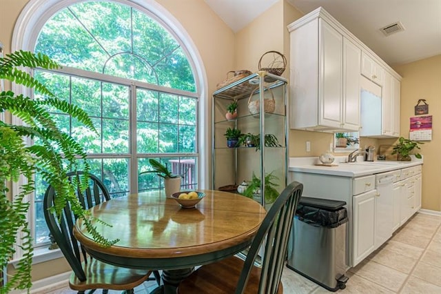 tiled dining area featuring sink