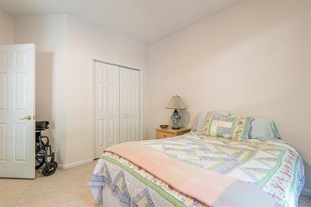 carpeted bedroom with a closet