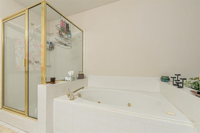 bathroom with tile patterned floors and independent shower and bath