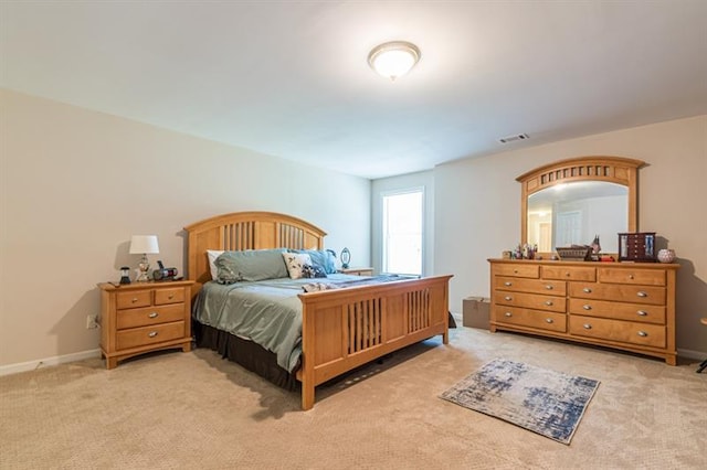 bedroom with light carpet