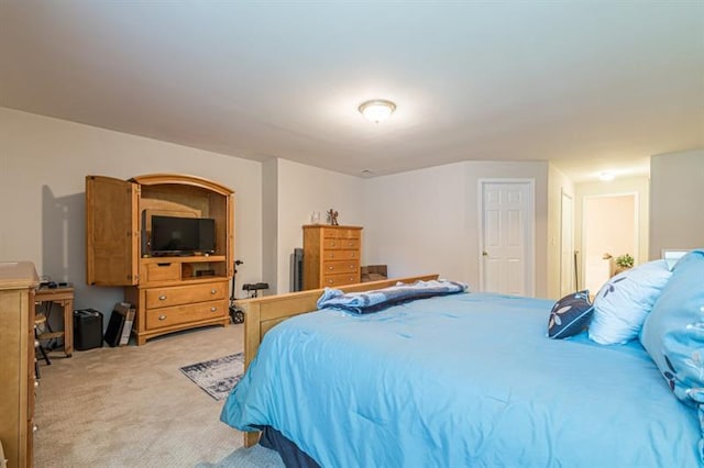 bedroom featuring light colored carpet