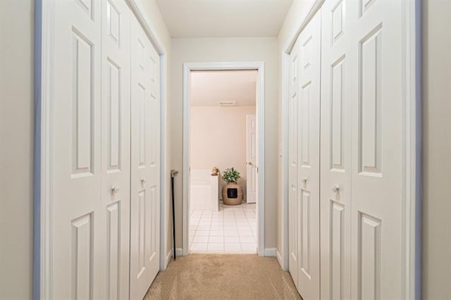 corridor with light carpet