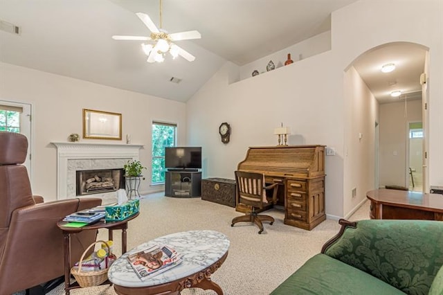 living room featuring carpet, a wealth of natural light, lofted ceiling, and a fireplace