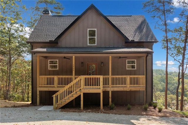 rear view of house featuring ceiling fan and a porch