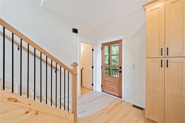 doorway to outside featuring light wood-type flooring