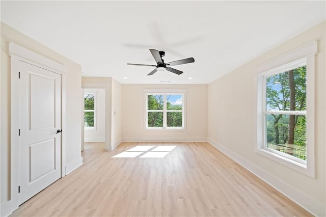 unfurnished room featuring ceiling fan and light wood-type flooring