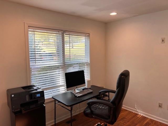 home office with dark wood-type flooring