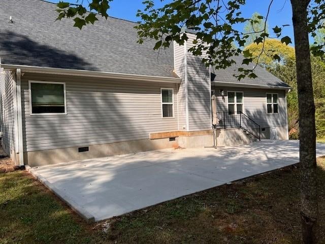 back of house with a patio