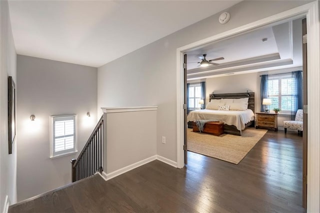 bedroom with dark wood-type flooring and ceiling fan