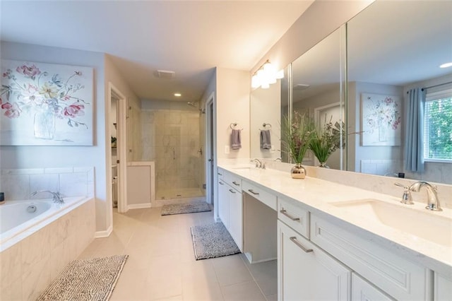 bathroom featuring vanity, tile patterned floors, and plus walk in shower