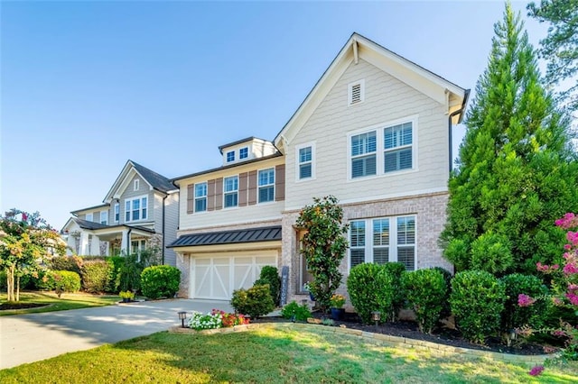 view of front of home featuring a garage and a front yard