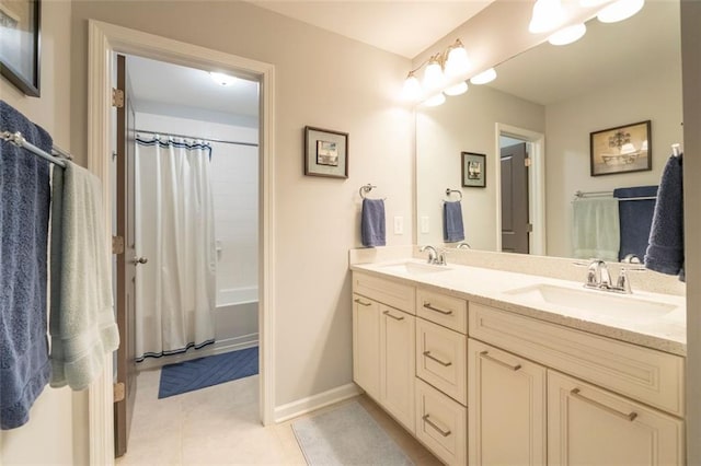 bathroom with vanity, tile patterned floors, and shower / bath combo with shower curtain