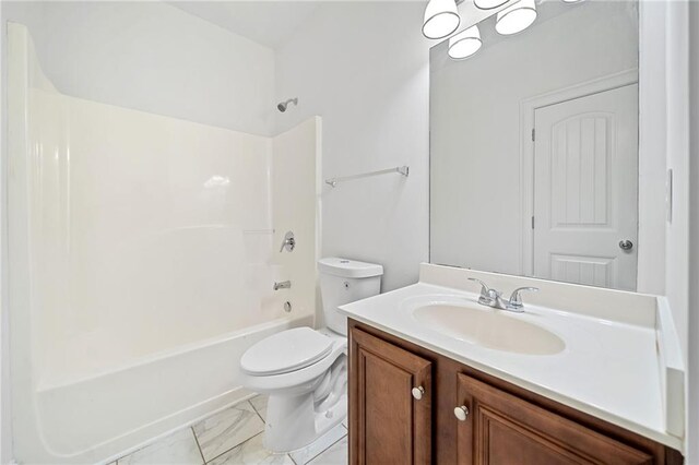 full bathroom featuring vanity, tub / shower combination, and toilet