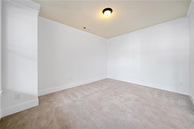 carpeted spare room with ornamental molding