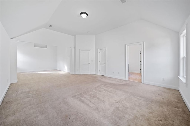 bonus room featuring light carpet and vaulted ceiling