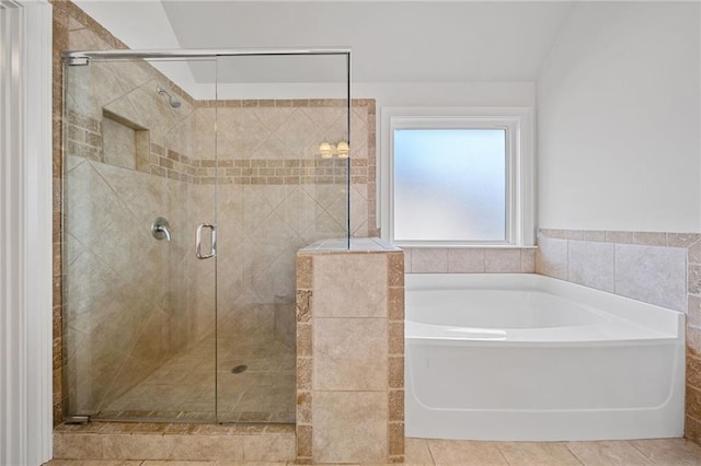 bathroom featuring tile patterned floors, plus walk in shower, and vaulted ceiling