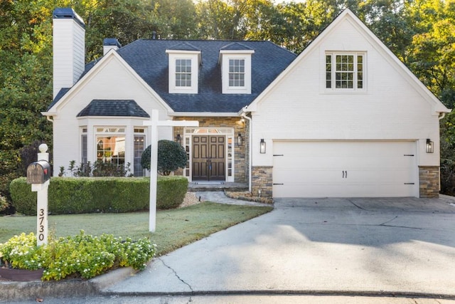 view of front of house featuring a front yard and a garage