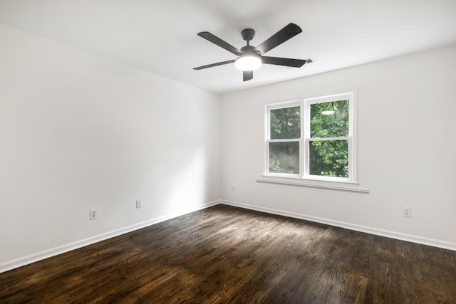 spare room featuring ceiling fan and dark hardwood / wood-style flooring