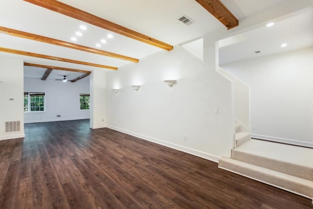 unfurnished living room with ceiling fan, lofted ceiling with beams, and dark hardwood / wood-style flooring