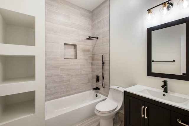 full bathroom featuring vanity, tiled shower / bath combo, and toilet