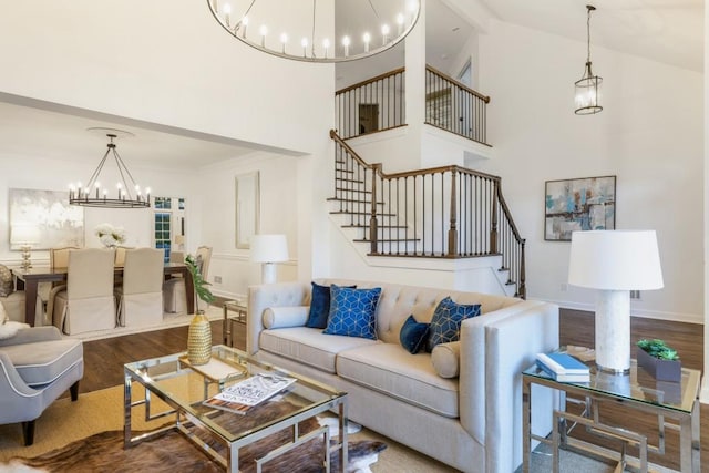 living room featuring hardwood / wood-style flooring and high vaulted ceiling