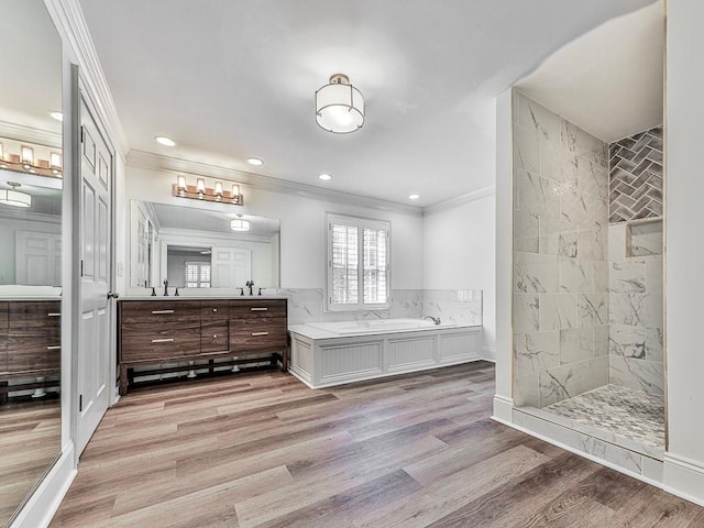 bathroom with vanity, separate shower and tub, wood-type flooring, and crown molding