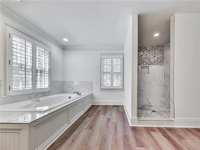 bathroom with hardwood / wood-style flooring, independent shower and bath, and crown molding