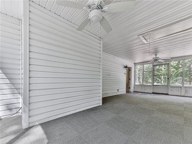 unfurnished sunroom featuring ceiling fan