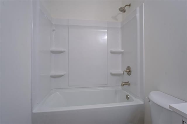 bathroom with a shower and toilet