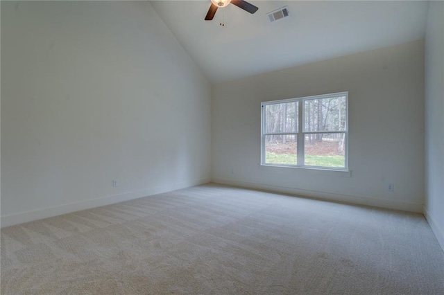 spare room featuring ceiling fan, high vaulted ceiling, visible vents, baseboards, and carpet