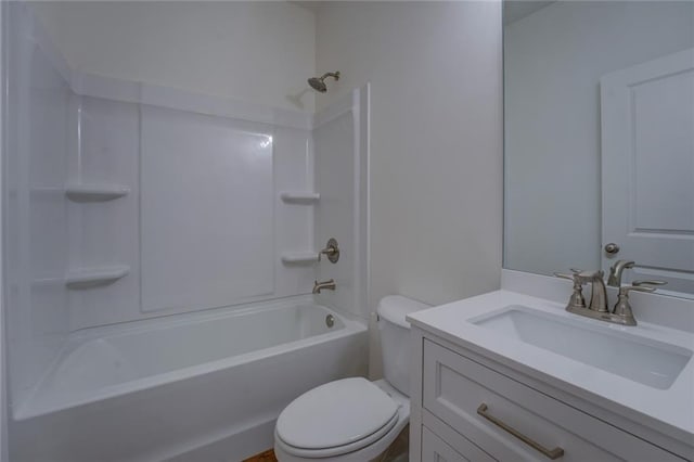 bathroom featuring shower / bath combination, vanity, and toilet