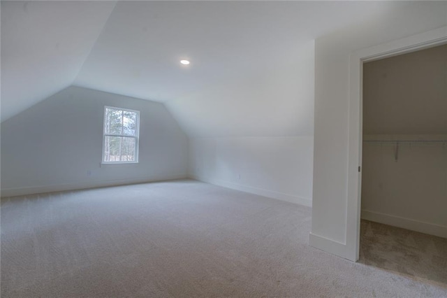 additional living space with lofted ceiling, recessed lighting, carpet, and baseboards