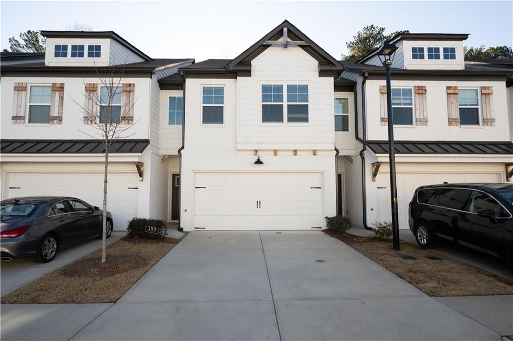 townhome / multi-family property featuring a garage